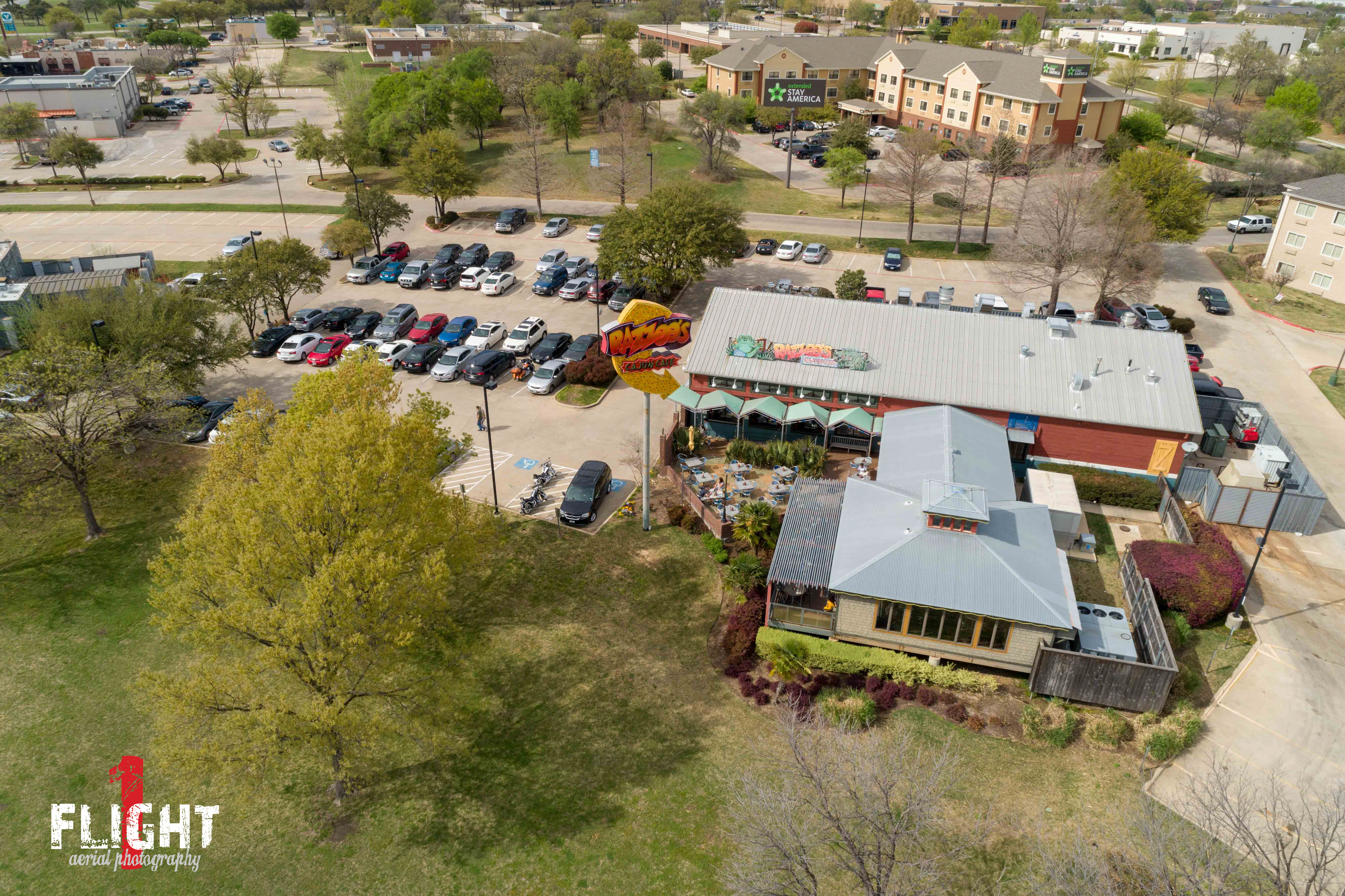 Professional real estate drone photography highlighting a commercial property exterior in Denton TX.