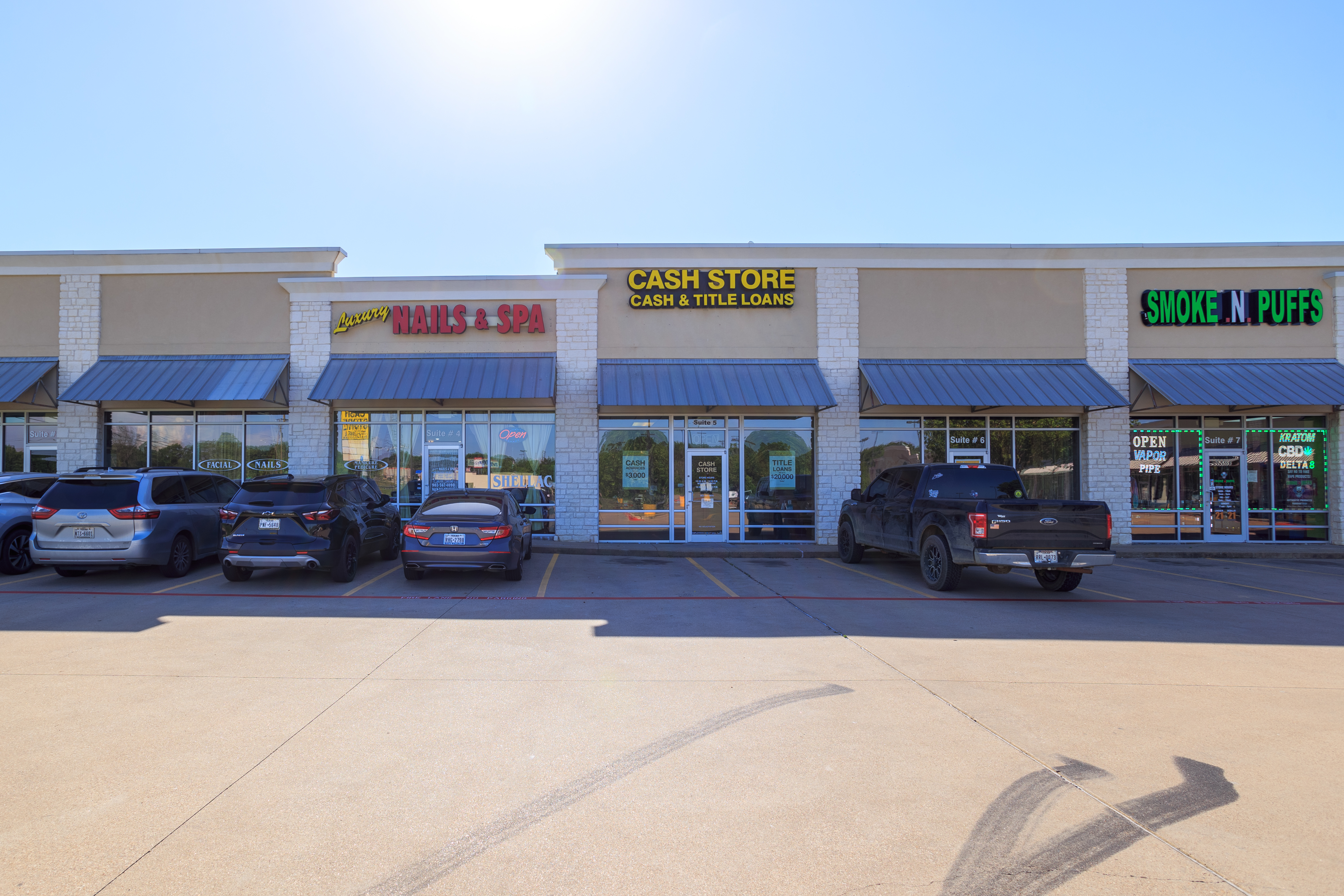 Commercial real estate photography showing Bridwell Shopping Center facade in Denton, TX.